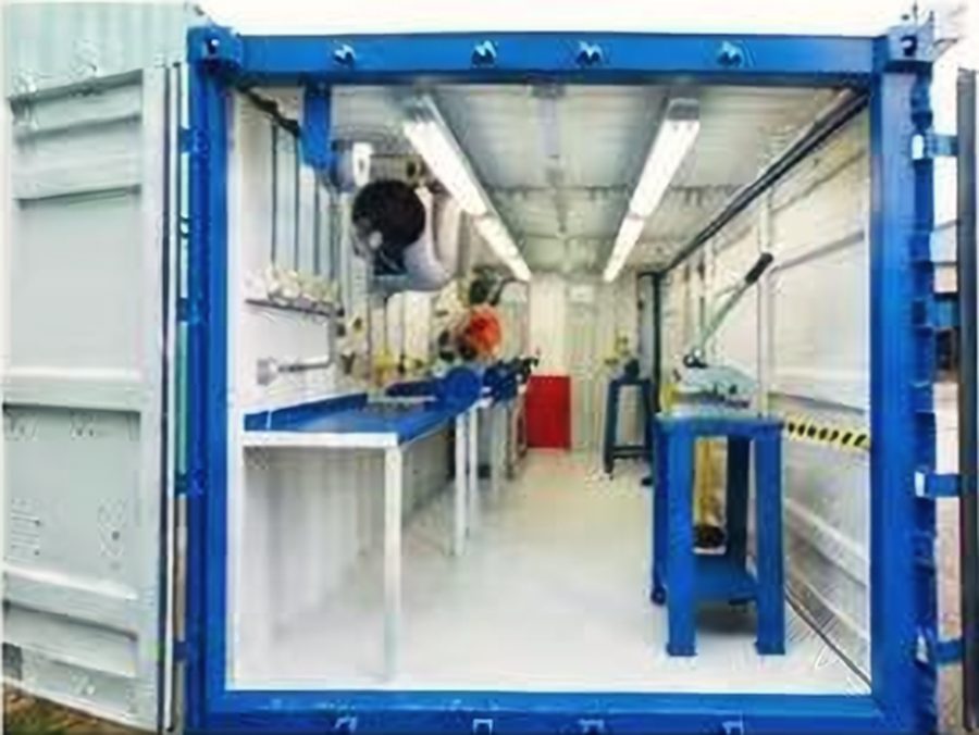 Maintenance, storage and production spaces with benches, lighting and power outlets.